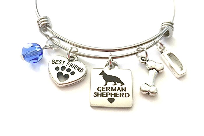German Shepherd themed personalized bangle bracelet. Antique silver charms and a genuine Swarovski birthstone colored element.