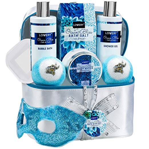 Home Spa Gift Baskets For Women - Bath and Body Gift Bag – Ocean Bliss Spa Set with Glittery Reusable Hot and Cold Eye Mask, Body Lotion, 2 Ex-Large Bath Bombs – 6oz Silver Travel Cosmetics Bag & More