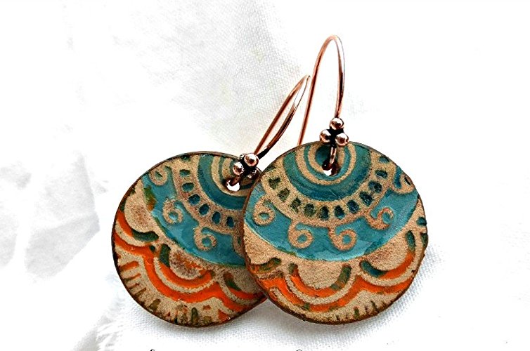 Round hand painted leather and copper metal earrings. Turquoise and orange.