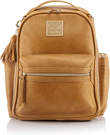 Chelsea   Cole for Itzy Ritzy Mini Diaper Bag Backpack - Studded Mini Diaper Bag Backpack with Changing Pad, 8 Pockets, Rubber Feet & Tassel; Caramel with Sweetheart Print Interior and Gold Hardware