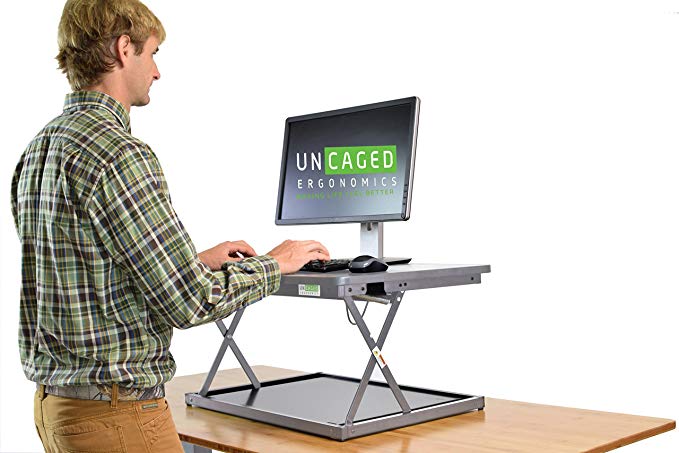 CHANGEdesk Mini Affordable Adjustable Height Laptop/Desktop Standing Desk Conversion. Compact ergonomic sit to stand desktop computer riser converter