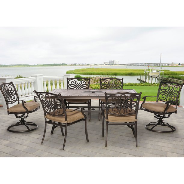 Hanover Monaco 7-Piece Patio Dining Set in Natural Oat with 4 Dining Chairs, 2 Swivel Rockers, and a 40" x 68" Tile-Top Table