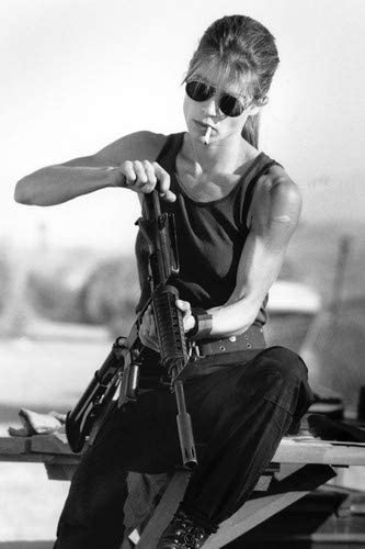 Linda Hamilton in Terminator 2: Judgment Day iconic Sarah Connor with cigarette loading gun 24x36 Poster