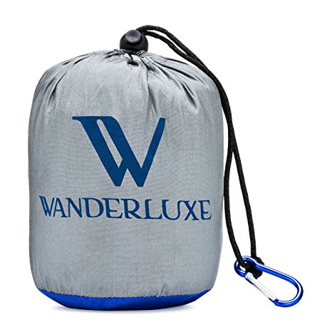 Wanderluxe Compact Beach and Outdoor Blanket | Huge 7' x 9' Folds Down To 5" x 7" Pouch! | Made of Parachute Nylon Ripstop Material | Perfect for Camping, Picnics, Concerts and More!