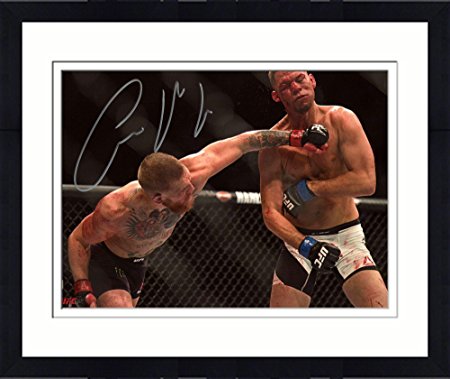 Framed Conor McGregor Ultimate Fighting Championship Autographed 8" x 10" Punching Nate Diaz Photograph - Fanatics Authentic Certified